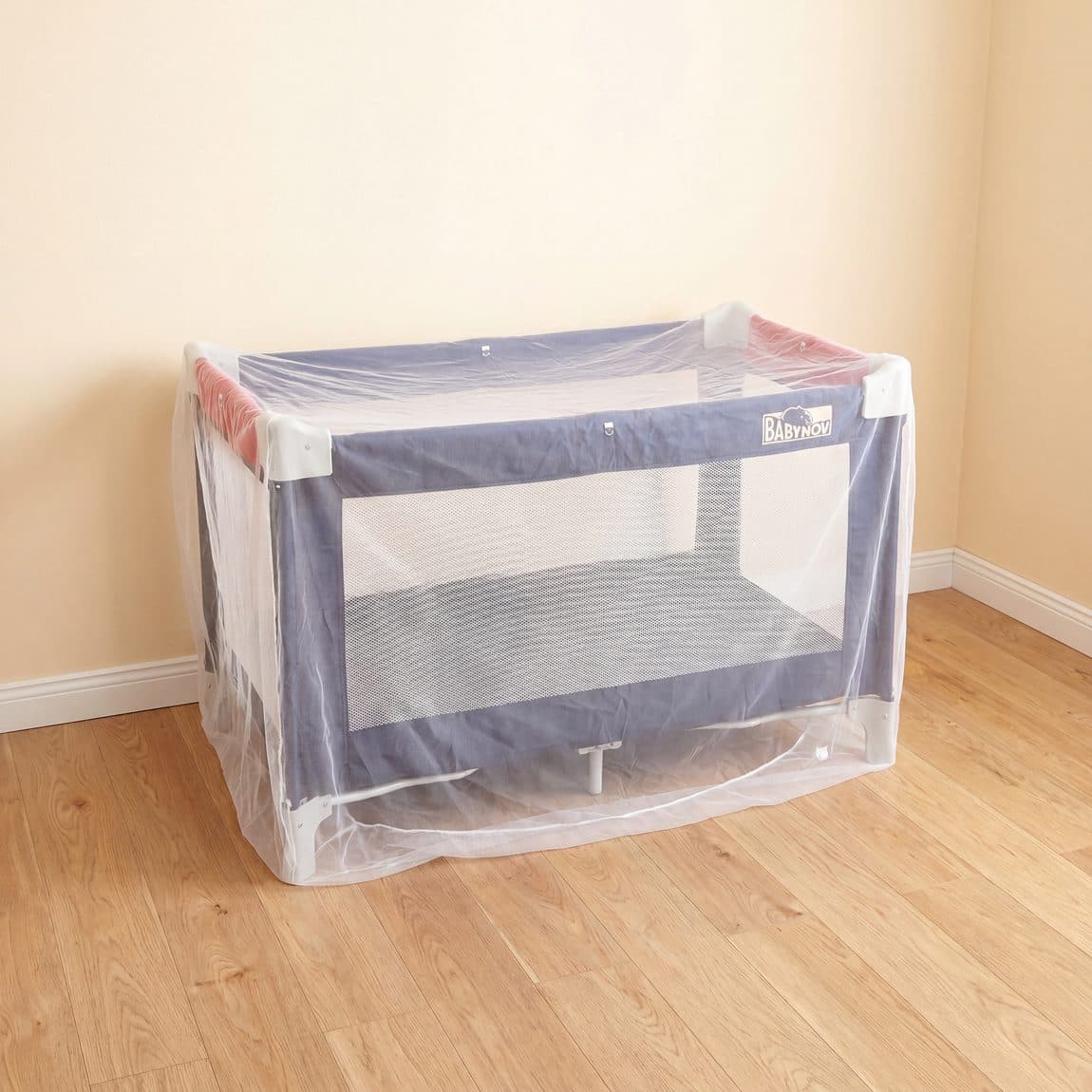 Mosticare Bambino Dorme treated cot net over a crib
